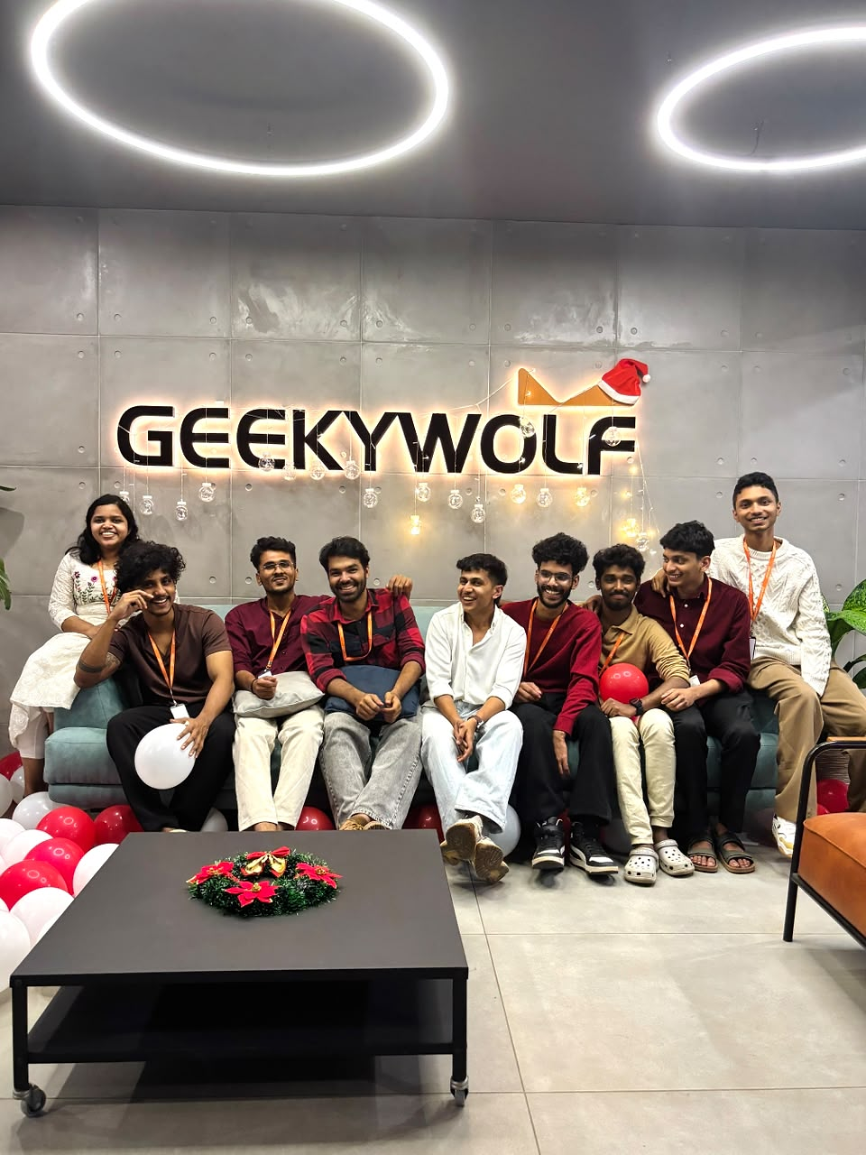 The Geeky Wolf team celebrating together in the office